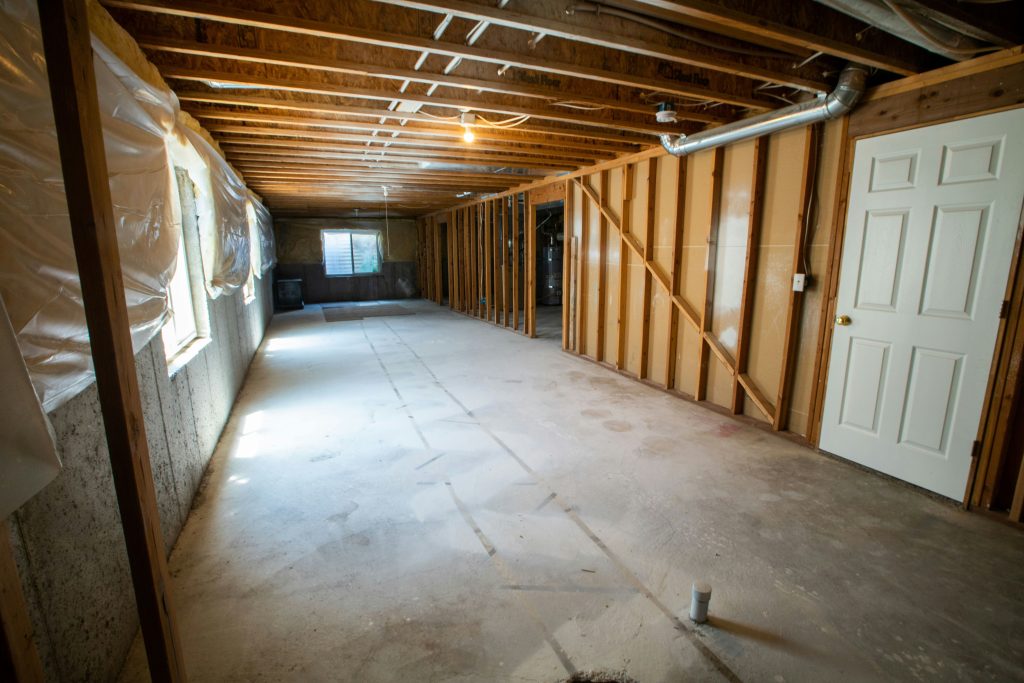 Unfinished basement with wood walls